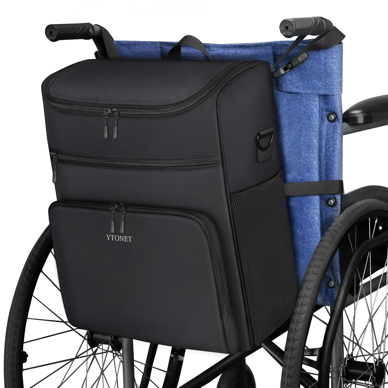 A black wheelchair bag hanging from the push handles on the back of a wheelchair